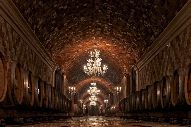 The original Del Dotto tasting room with barrels lining the walls of the caves hand dug by the Chinese in the 1800's