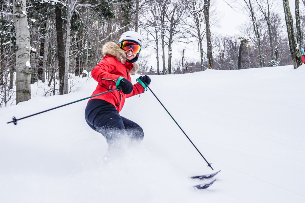 Our editor, Jenna Bostock, kicks up some snow on some seriously fresh groomers.